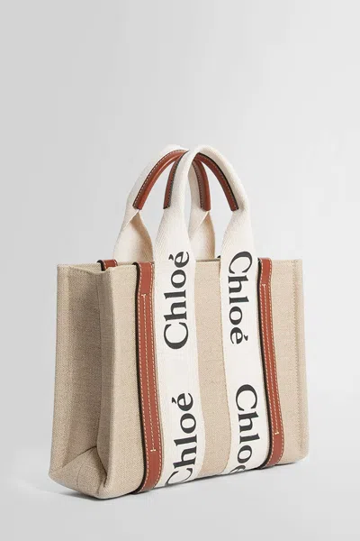 Chloé Structured White Handbag With Bold Branding In Beige