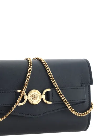 Shop Versace Shoulder Bag In Black- Gold