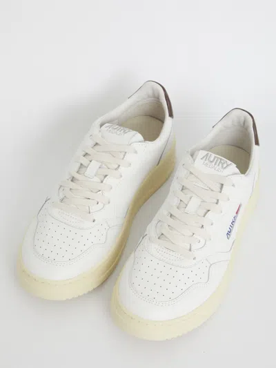 Shop Autry Medalist White And Brown Sneakers