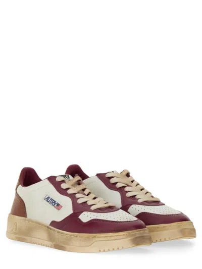 Shop Autry Super Vintage Sneaker In Leather Rasperry