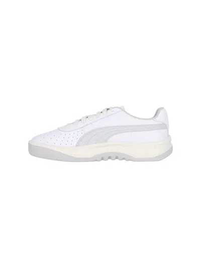 Shop Puma Sneakers In White