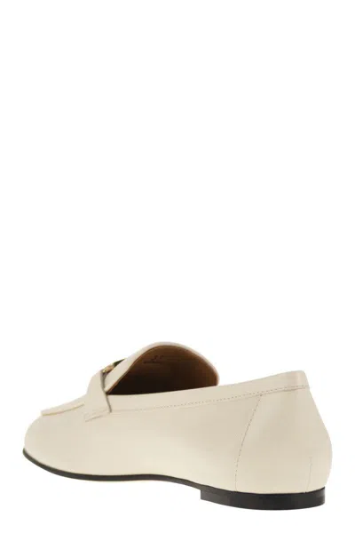 Tod's Logo-plaque Leather Loafers In Beige