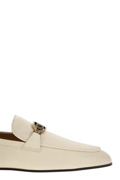 Tod's Logo-plaque Leather Loafers In Beige