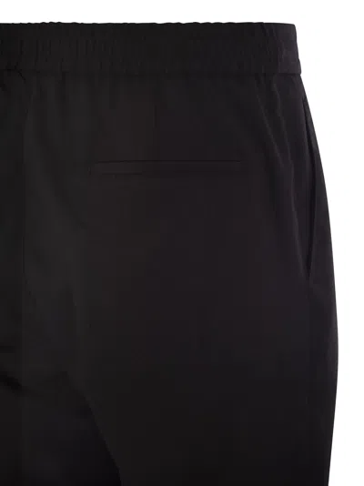 Brunello Cucinelli Men Leisure Fit Trousers In Garment-dyed Linen Gabardine With Drawstring And Doub