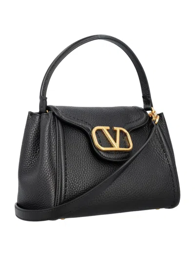 Shop Valentino Garavani Top Handle Bag In Black