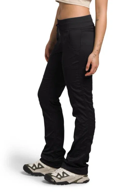 Shop The North Face Aphrodite 2.0 Motion Water Repellent Pants In Tnf Black-npf