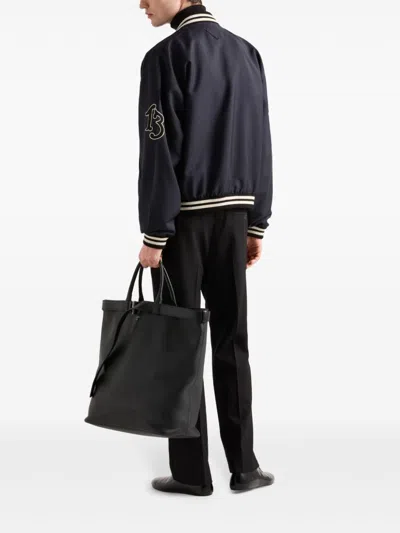 Shop Prada Patch Bomber Jacket In Blue