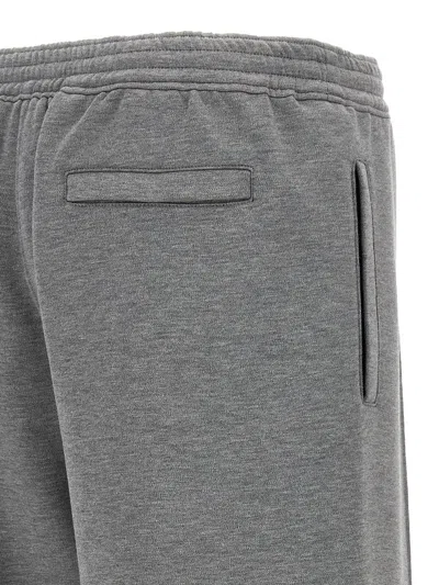 Shop Givenchy Metallic Logo Joggers In Gray