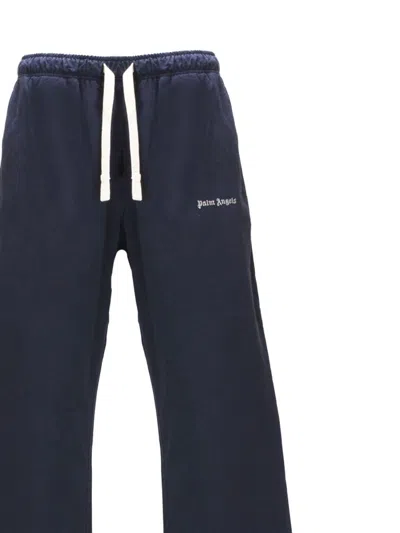 Shop Palm Angels Blue Flared Trousers In Cotton Man