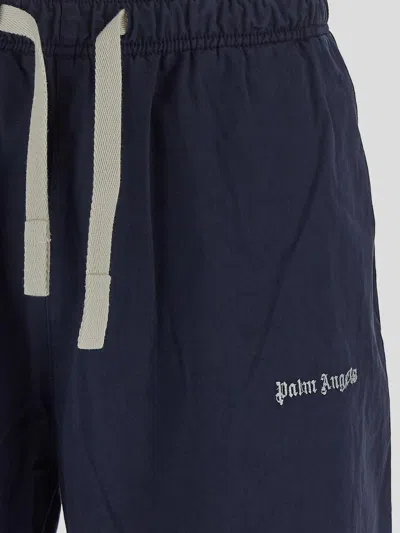 Shop Palm Angels Blue Flared Trousers In Cotton Man