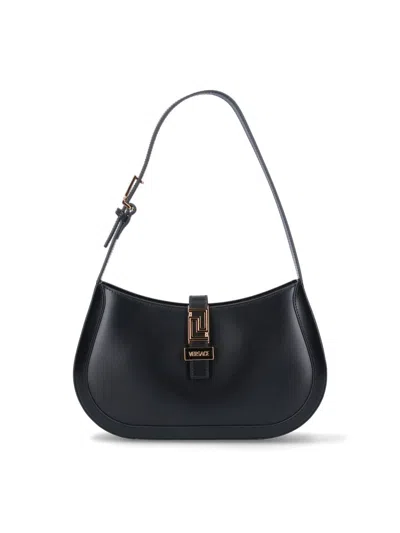 Shop Versace Handbags. In Black