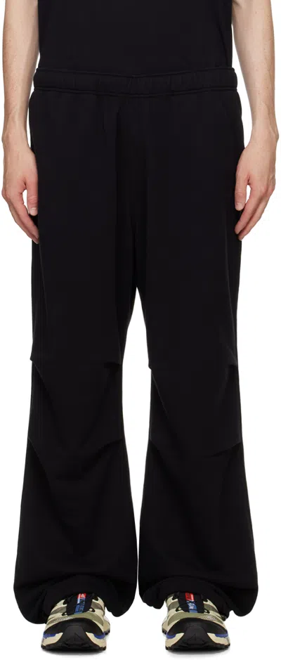 Shop Mm6 Maison Margiela Black Tucked Sweatpants In 900 Black