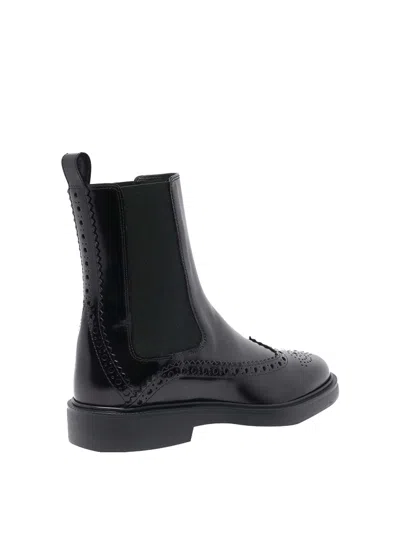 Shop Tod's Leather Booties In Negro