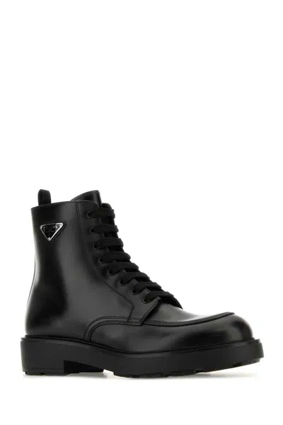 Prada Logo-plaque Panelled Ankle Boots In Black
