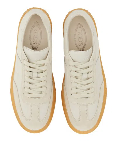 Shop Tod's Sneakers In White