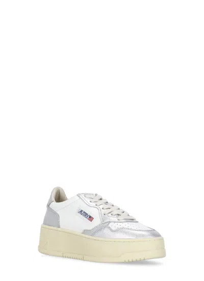 Shop Autry Sneakers In White