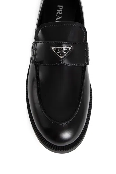 Prada Leather Loafers With Decorative Buckle And Round Toe In Black