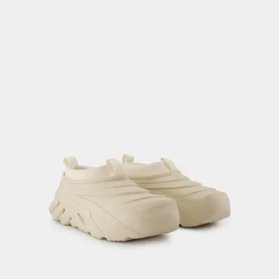 Crocs Ivory Rubber Echo Storm Slip Ons In Beige