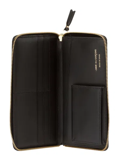 Comme Des Garçons Continental Wallet With Bold Logo Print In Black