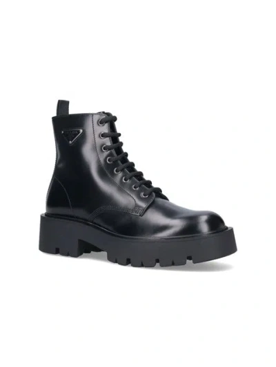 Shop Prada Men Brushed Leather Ankle Boots In Black