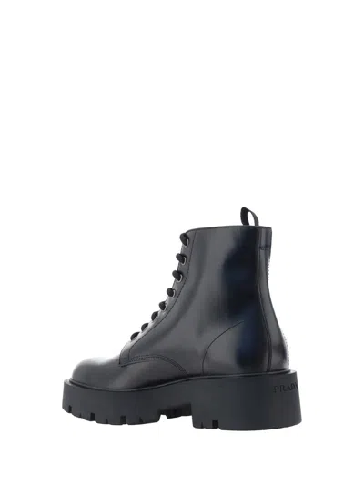 Prada Logo-plaque Panelled Ankle Boots In Black