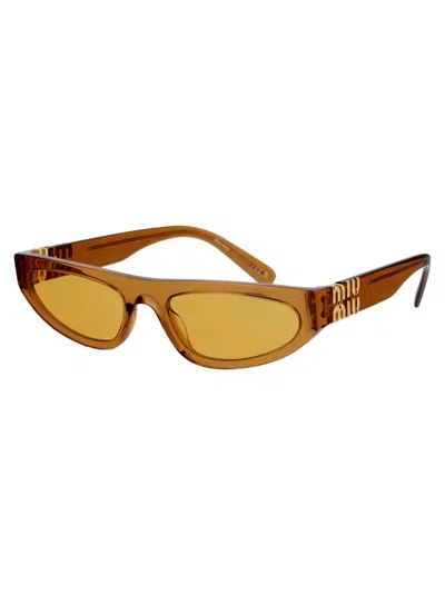 Shop Miu Miu Sunglasses In 15t0b7 Caramel Trapsarent