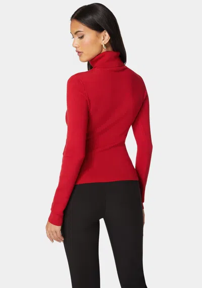 Bebe Fitted Turtle Neck Ornate Belt Sweater In Salsa