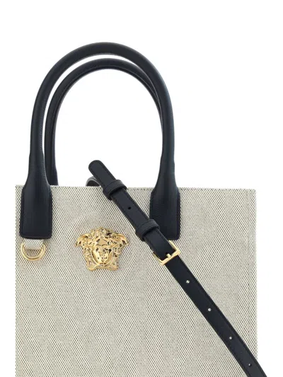 Shop Versace Handbags In Beige