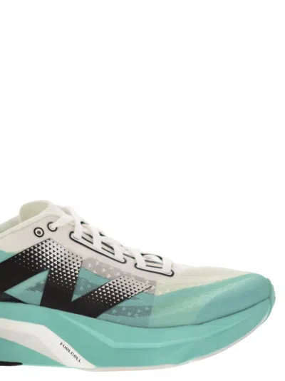 Shop New Balance Fuel Cell Rebel V4 Sneakers