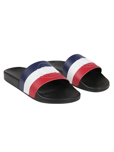 Shop Moncler Slippers In Black