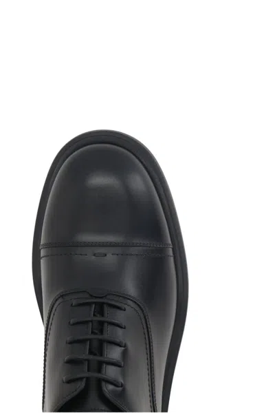 Shop Ferragamo Flat Shoes In Black