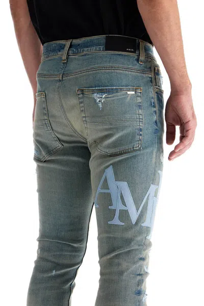 Shop Amiri Leather Logo Jeans With Eight Words In Blue