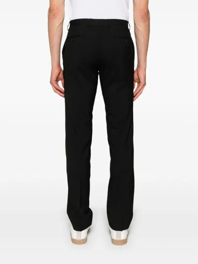 Shop Sandro Pinstriped Wool Tailored Trousers In 黑色