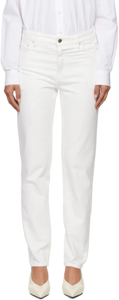 Shop Totême White Low Taper Jeans In White 047