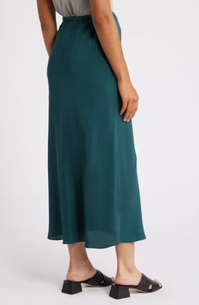 Shop Eileen Fisher Bias Cut Silk Maxi Skirt In Pine