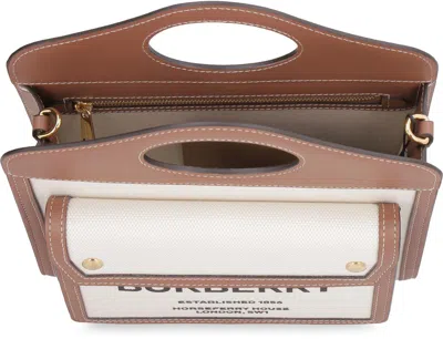 Shop Burberry Pocket Canvas Handbag In Beige