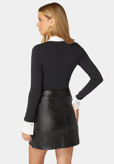 Bebe Henley Satin Combo Knit Bodysuit In Black,white Alyssum