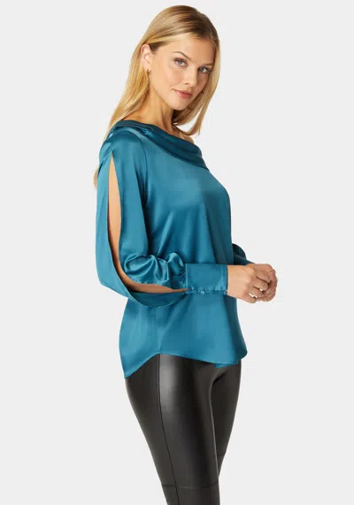 Bebe Asymmetrical Long Sleeve Slit Detail Satin Blouse In Deep Lagoon