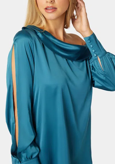 Bebe Asymmetrical Long Sleeve Slit Detail Satin Blouse In Deep Lagoon