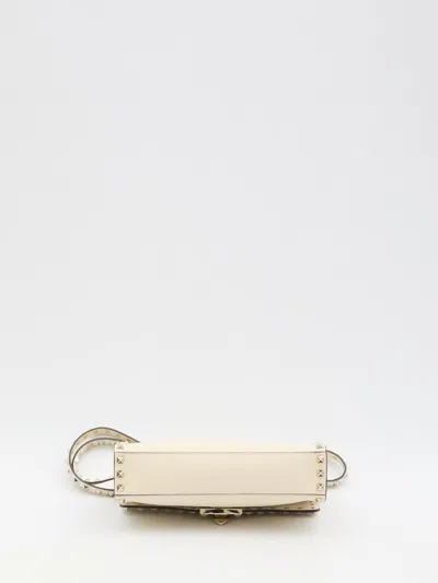 Shop Valentino Rockstud Small Crossbody Bag In Beige