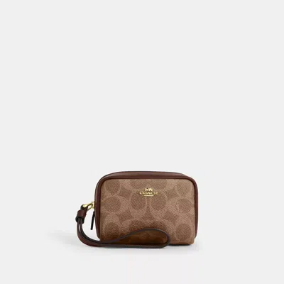 Coach Outlet Pouch Wristlet In Signature Canvas In Beige