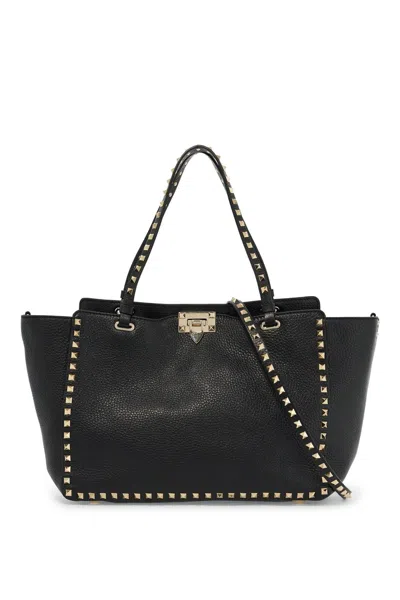 Shop Valentino Garavani Medium Rockstud Handbag