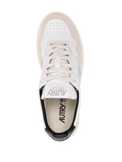 Shop Autry Sneakers In White