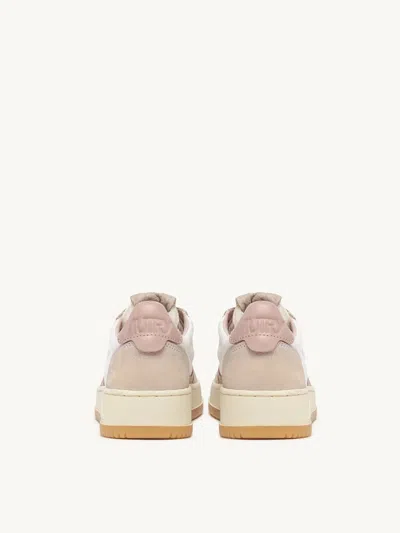 Shop Autry Medalist Low Sneakers In White Canvas And Pink Leather