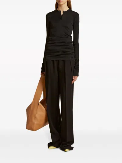 Khaite Cessie Pleated High-waisted Trousers