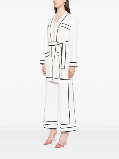 Shop Edward Achour Paris Contrasting-trim Belted Coat In White