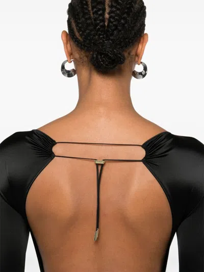 Maison Close Open-back Long-sleeve Jumpsuit In Black
