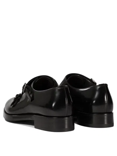 Prada Double-buckle Loafers In Black