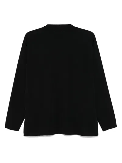 Nuur Merino-wool Sweater In Black