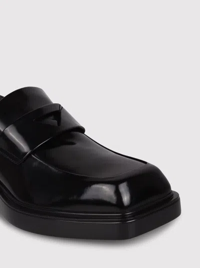 Shop Prada Brushed Leather Loafers